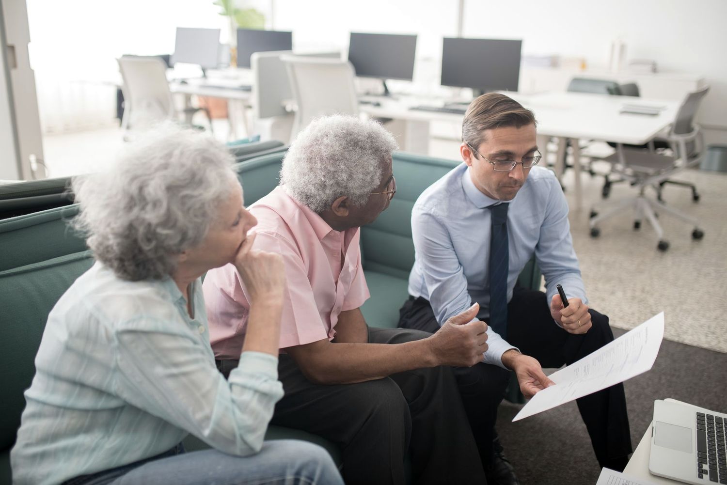 A banker reviewing account options with a couple