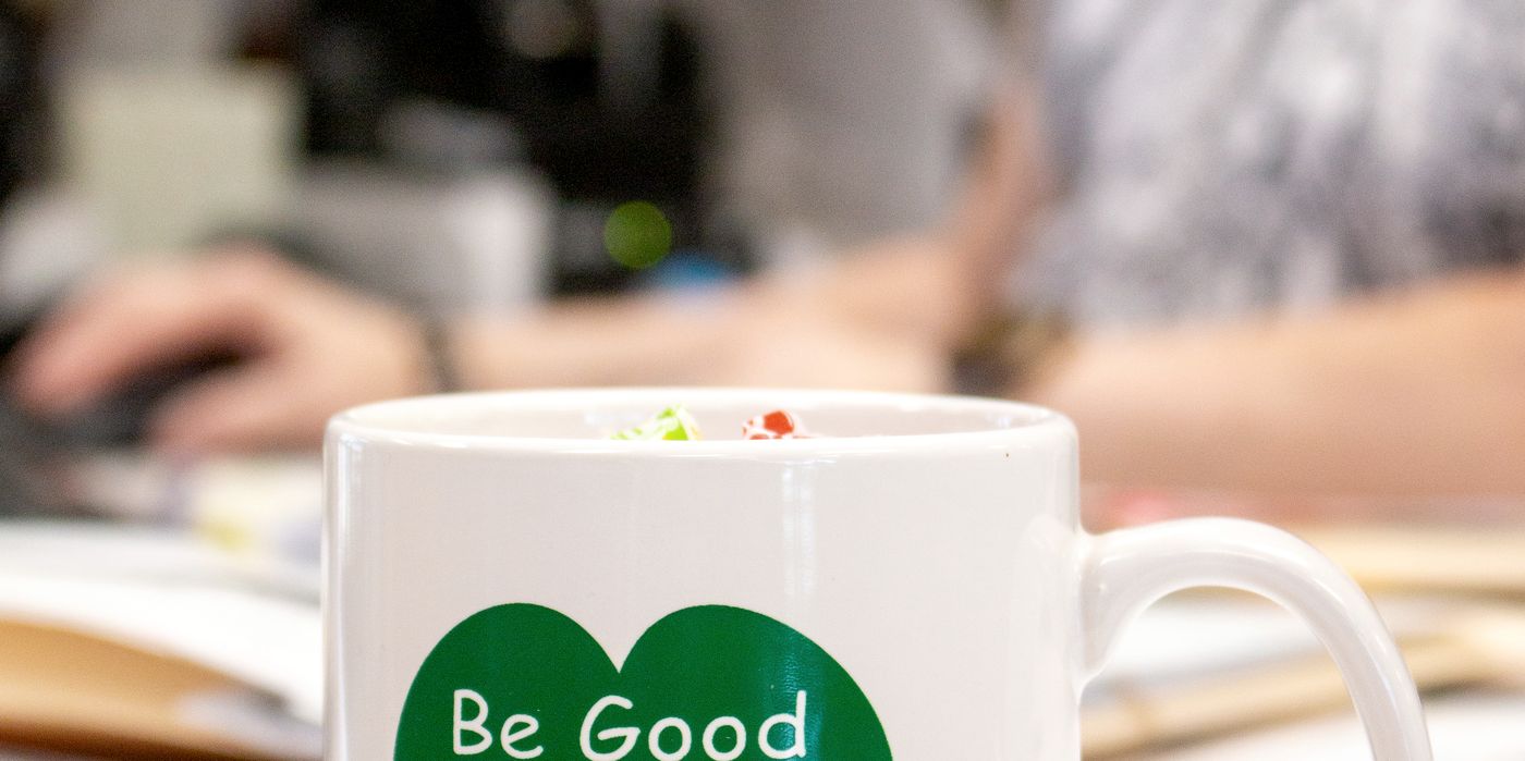 A Greenville Savings Bank mug reading Be Good To Your Heart